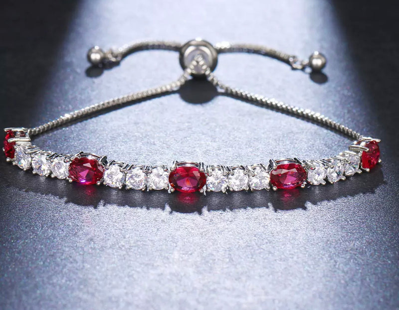 PULSERA PLATEADA AJUSTABLE  CRISTALES ROJOS CON CRISTAL